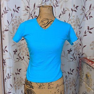 Blue V-neck. Size:: S